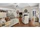 Open-concept living room with hardwood floors, neutral décor, and a staircase leading to upper level at 518 Heartland Ct., Murrells Inlet, SC 29576