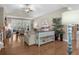 Inviting living room with hardwood floors, a ceiling fan, and access to outdoor space at 518 Heartland Ct., Murrells Inlet, SC 29576