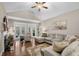 Spacious living room featuring hardwood floors, comfortable seating, and a cozy fireplace at 518 Heartland Ct., Murrells Inlet, SC 29576