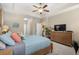 Comfortable main bedroom with a wood dresser, a plant, and soft carpet flooring at 518 Heartland Ct., Murrells Inlet, SC 29576