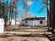A beautiful yard with multiple structures and towering trees offering a sense of privacy at 530 Yarboro St., Mullins, SC 29574
