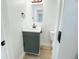 Bright bathroom featuring a modern vanity, mirror, and hardwood floors at 530 Yarboro St., Mullins, SC 29574