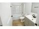 Bathroom featuring a shower-tub combo, updated vanity, and neutral color scheme at 530 Yarboro St., Mullins, SC 29574