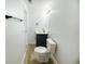 Bright bathroom featuring a modern vanity, mirror, and hardwood floors at 530 Yarboro St., Mullins, SC 29574
