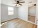 Bright bedroom featuring a ceiling fan and vinyl flooring, creating a modern and inviting space at 530 Yarboro St., Mullins, SC 29574