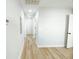 Hallway with neutral walls and flooring, leading to several rooms at 530 Yarboro St., Mullins, SC 29574