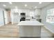 Kitchen featuring a center island, stainless appliances, and white cabinets, providing a modern space at 530 Yarboro St., Mullins, SC 29574