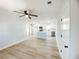 Bright open-concept kitchen with modern white cabinets, a large center island, and stainless steel appliances at 530 Yarboro St., Mullins, SC 29574