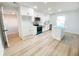 Bright, renovated kitchen with an island, stainless steel appliances, and modern finishes at 530 Yarboro St., Mullins, SC 29574