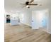 Bright open-concept kitchen with modern white cabinets, a large center island, and stainless steel appliances at 530 Yarboro St., Mullins, SC 29574
