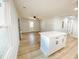 Bright living room featuring an island, hardwood floors, and a ceiling fan at 530 Yarboro St., Mullins, SC 29574