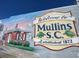 Mural of the city of Mullins, SC, featuring a train depot and the welcome sign to the city at 530 Yarboro St., Mullins, SC 29574