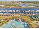 Overhead shot showing a marina with many boats and a pool with city and ocean views in the background at 5801 Oyster Catcher Dr. # 1614, North Myrtle Beach, SC 29582