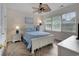 Bedroom with wood look tile floors and a white wood bed with blue comforter at 5801 Oyster Catcher Dr. # 1614, North Myrtle Beach, SC 29582