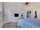 Bedroom with coastal decor, ceiling fan, and natural light from the large windows at 5801 Oyster Catcher Dr. # 1614, North Myrtle Beach, SC 29582