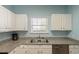Cozy kitchen with stainless steel dishwasher and double basin sink beneath a window at 5801 Oyster Catcher Dr. # 1614, North Myrtle Beach, SC 29582
