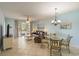 Open concept living and dining area with tile floors, ceiling fan, and patio access at 5801 Oyster Catcher Dr. # 1614, North Myrtle Beach, SC 29582