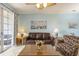 Cozy living room with tile floors, ceiling fan, and sliding glass doors to the patio at 5801 Oyster Catcher Dr. # 1614, North Myrtle Beach, SC 29582