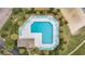 Aerial view of a community pool surrounded by lounge chairs and well-manicured landscaping at 5801 Oyster Catcher Dr. # 1614, North Myrtle Beach, SC 29582