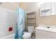 Standard bathroom including tub with shower, storage shelves, toilet and vanity with medicine cabinet at 5801 Oyster Catcher Dr. # 724, North Myrtle Beach, SC 29582
