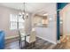 Dining area with glass table and view to kitchen at 5801 Oyster Catcher Dr. # 724, North Myrtle Beach, SC 29582