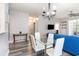Dining area with glass table and view to kitchen and living room at 5801 Oyster Catcher Dr. # 724, North Myrtle Beach, SC 29582