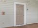 Beige door with white trim and the number 724 at 5801 Oyster Catcher Dr. # 724, North Myrtle Beach, SC 29582