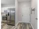 Bright kitchen features stainless steel appliances, white cabinets, and wood-look flooring at 5801 Oyster Catcher Dr. # 724, North Myrtle Beach, SC 29582