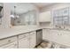 Bright kitchen with modern countertops and stainless steel appliances overlooking the dining area at 5801 Oyster Catcher Dr. # 724, North Myrtle Beach, SC 29582