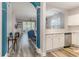 Open-concept living room flows into the kitchen with gray floors and modern finishes at 5801 Oyster Catcher Dr. # 724, North Myrtle Beach, SC 29582