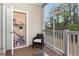A screened-in patio with a small storage closet and furniture to enjoy the outdoors at 5801 Oyster Catcher Dr. # 724, North Myrtle Beach, SC 29582