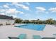 Community pool with lounge chairs, blue water, and clear skies on a sunny day at this property at 5801 Oyster Catcher Dr. # 724, North Myrtle Beach, SC 29582
