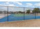 Outdoor tennis court area enclosed by a black fence on this property at 5801 Oyster Catcher Dr. # 724, North Myrtle Beach, SC 29582
