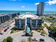 Aerial view showcasing the building's facade, canopy entrance, parking, and landscaping at 5905 S Kings Hwy. # 318B, Myrtle Beach, SC 29575
