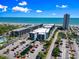 Aerial view featuring condo complex, swimming pool, and beach at 5905 S Kings Hwy. # 318B, Myrtle Beach, SC 29575