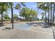 Outdoor basketball court surrounded by mature trees and greenery at 5905 S Kings Hwy. # 318B, Myrtle Beach, SC 29575