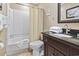 Bathroom with a shower/bathtub combo and a dark granite countertop at 5905 S Kings Hwy. # 318B, Myrtle Beach, SC 29575