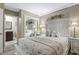 Comfortable bedroom with ensuite bathroom and large mirror at 5905 S Kings Hwy. # 318B, Myrtle Beach, SC 29575