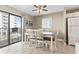 Dining area with a ceiling fan, dining table, and balcony access at 5905 S Kings Hwy. # 318B, Myrtle Beach, SC 29575