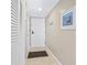 Hallway with neutral walls, tiled floor, storage closet, and decorative wall art at 5905 S Kings Hwy. # 318B, Myrtle Beach, SC 29575
