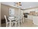 Bright kitchen with white cabinetry, stainless steel appliances, and a dining area for casual meals at 5905 S Kings Hwy. # 318B, Myrtle Beach, SC 29575