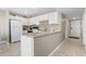 Kitchen with modern appliances, mosaic backsplash, and entrance doorway at 5905 S Kings Hwy. # 318B, Myrtle Beach, SC 29575