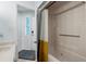 Bathroom with a shower-tub combo, toilet, and entrance to the hallway at 625 N Waccamaw Dr. # 102, Murrells Inlet, SC 29576
