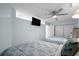 Comfortable bedroom with two beds, ceiling fan, closet, and tv at 625 N Waccamaw Dr. # 102, Murrells Inlet, SC 29576