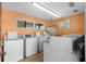 Clean laundry room with multiple washing machines for convenient use at 625 N Waccamaw Dr. # 102, Murrells Inlet, SC 29576