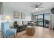 This cozy living room features stylish furniture and a view overlooking the inviting outdoor space at 625 N Waccamaw Dr. # 102, Murrells Inlet, SC 29576