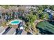 Aerial view showcasing community pool, lake, and lush landscaping at 670 2Nd Ave. N, North Myrtle Beach, SC 29582