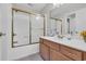 Bathroom featuring a single sink vanity and a shower-tub combo with gold-framed sliding doors at 670 2Nd Ave. N, North Myrtle Beach, SC 29582