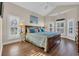 Bright bedroom with natural light, ceiling fan, wood flooring, and a large window at 670 2Nd Ave. N, North Myrtle Beach, SC 29582