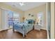 Bright bedroom featuring hardwood floors, a large window, and modern decor at 670 2Nd Ave. N, North Myrtle Beach, SC 29582